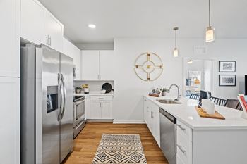 Fully Equipped Kitchen with White Cabinets